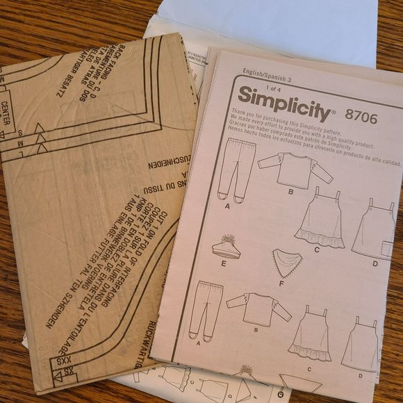 Simplicity 8706 Baby Gear - Jumper, Leggings, Bib, Ruffle Top, Pom Pom Hat XXS-L - Picture 4 of 4